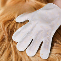 Cleaning mitt gliding over long pet fur