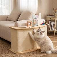 Natural sisal cat scratcher end table beside a sofa with a ragdoll cat scratching