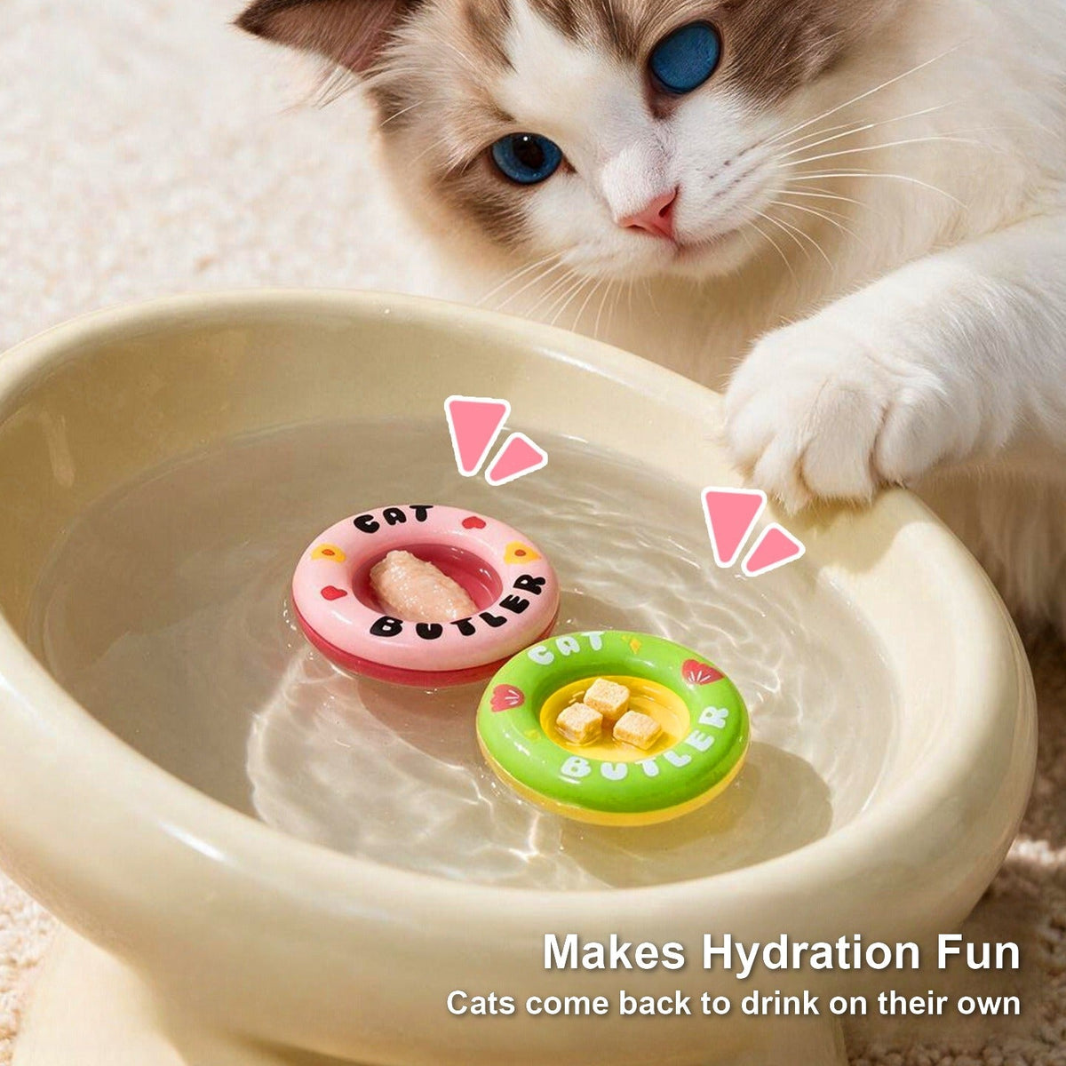 Pink and green bobbing float rings in a cat water bowl
