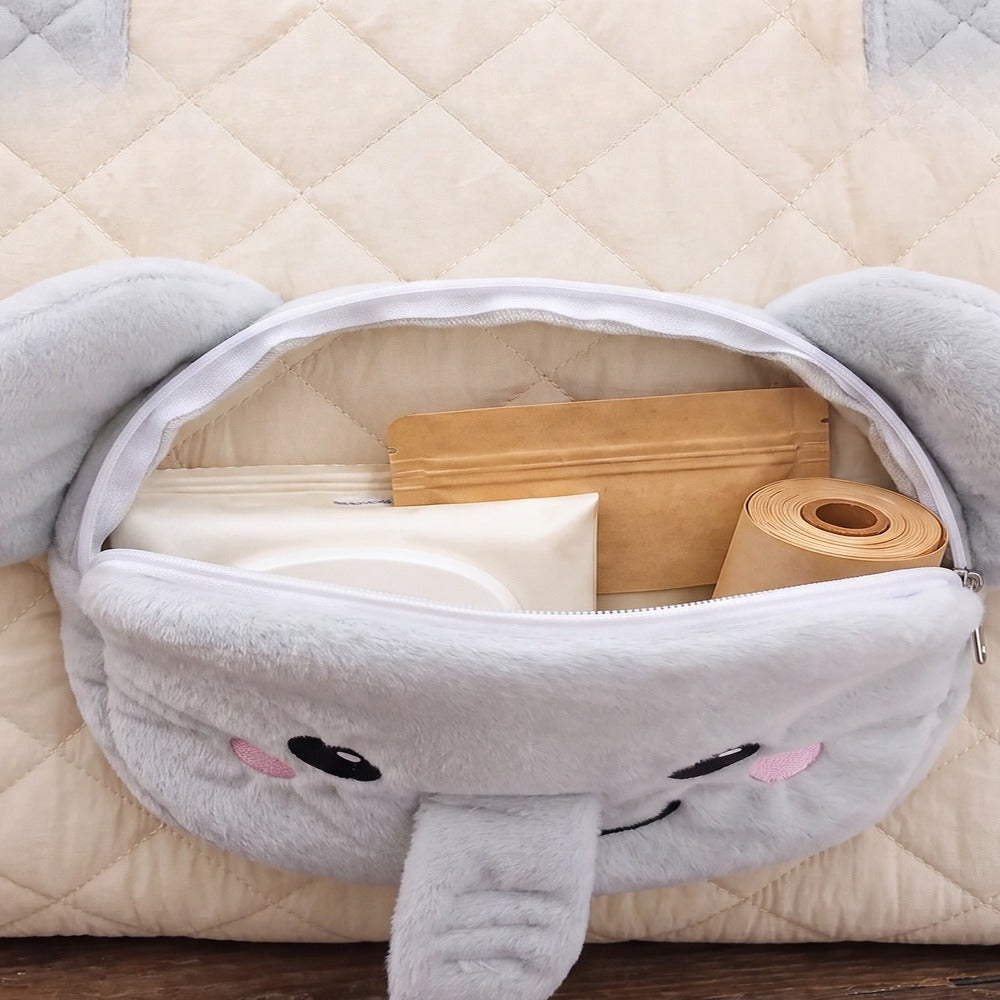 Elephant-face front pocket of the carrier holding small items