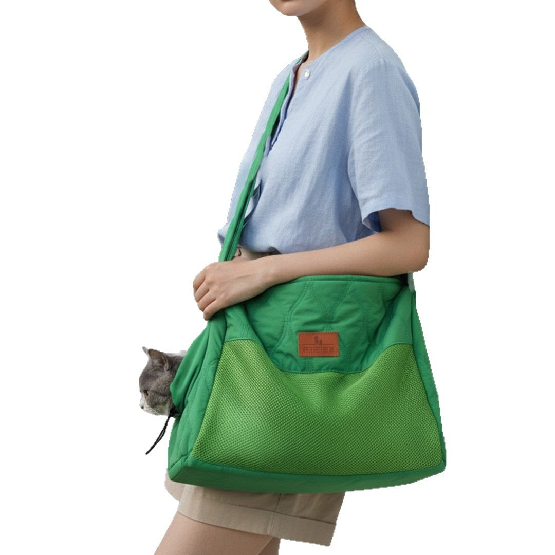Green cat carrier bag worn crossbody