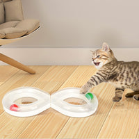 Tabby kitten chasing the track balls