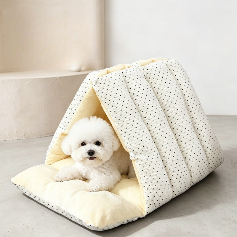 Plush-lined triangle cat cave bed with a fluffy dog lying on the open cushion