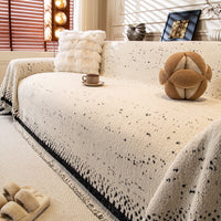 Speckled plush sofa cover in ivory and black