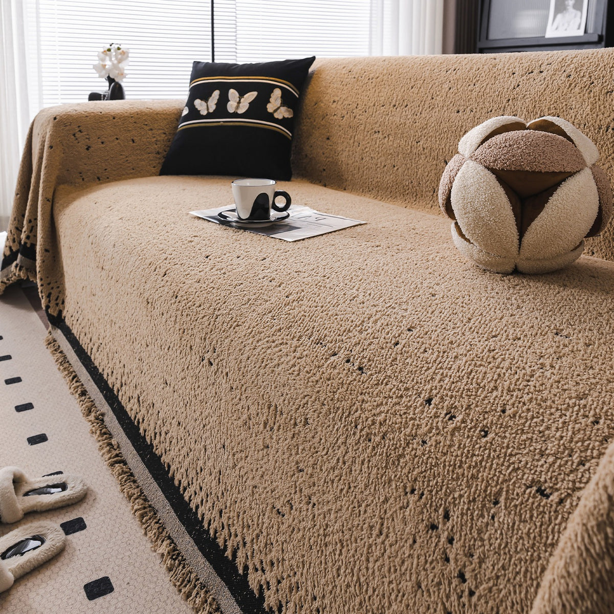 Speckled plush sofa cover in coffee and black