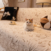 Cat lounging on the plush sofa cover